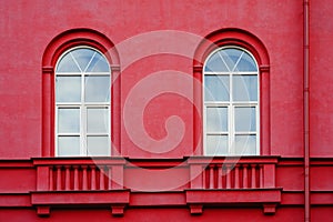 Part of the multistory red houses with Windows and balcony