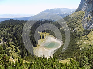Part of the natural beauty of Durmitor - Jablan Lake - hidden in a beautiful mountain forest.