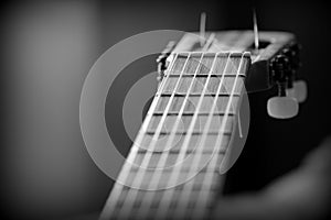 Part of an old acoustic guitar. Black and white