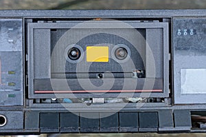 part of an old black electronic tape recorder