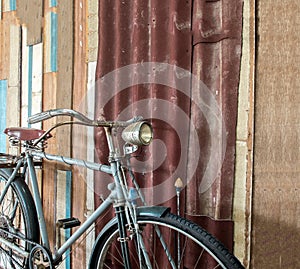 Part of Old Classic Bicycle Parked near Vintage Style Wall at The Corner with Copyspace to input Text