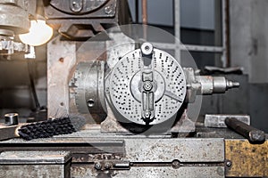 Part of the old equipment for metalworking milling machine close-up in the shop of the industrial plant