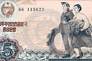Part of old five North Korea Won banknote background. High resolution vintage photo of obverse side North Korean bill, close up