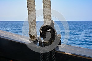 Part of an old sailing ship facing the open sea