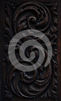 part of an old wooden carved door with a beautiful pattern