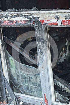 part of one burnt metal-plastic white black window frame