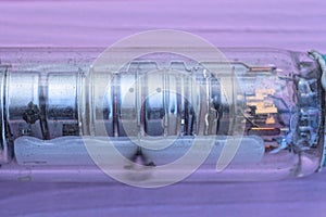 part one of a long glass old lamp on a kinescope tube of a retro tv photo