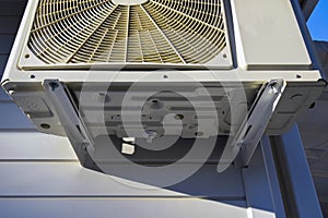 Part of outdoor unit of air conditioner. Dedicated mounting bracket and bolting. Wall mounting. Bottom view. Close-up. photo