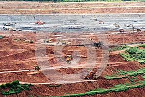 Part of a pit with big mining truck working.