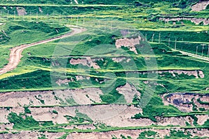 Part of a pit with big mining truck working.