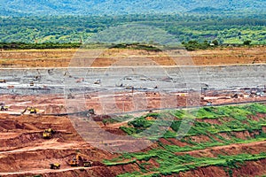 Part of a pit with big mining truck working.