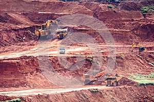 Part of a pit with big mining truck working.