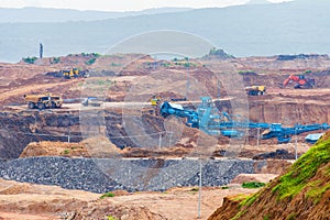 Part of a pit with big mining truck working. Coal mining at an open pit