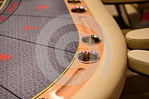 Part of poker table with cupholders