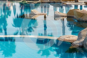 Part of the pool with blue clear water, full frame. Horizontal frame