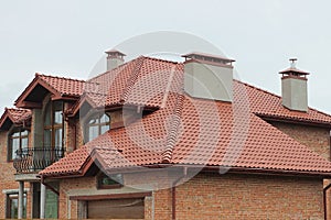 Part of a private brick house with an iron balcony