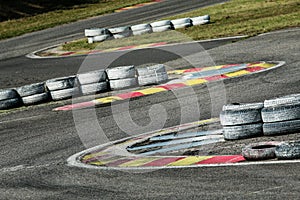Part of racetrack with curbs and tyres