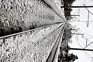 Part of the railway with rails in the snow