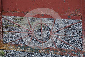 Part of the red iron gate with a pattern