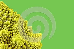Part of a romanesco head in front of a green background