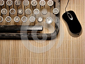 Part of ruined keyboard with modern mouse