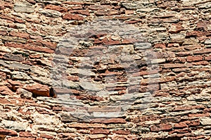 Part of the ruined stone wall of  fortress. Stone texture, abstract background