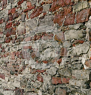 Part of the ruined stone wall of  fortress. Stone texture, abstract background