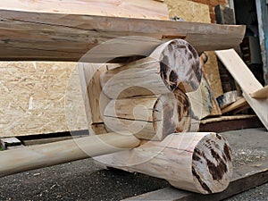 part of a rustic log bench with decorative burnt fragments