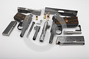 Part of Semi automatic pistol handguns with .45 bullets on white background , The same of single action operating system , 1911