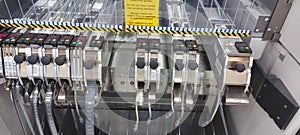 Part of the Siemens assembly line with component feeders photo