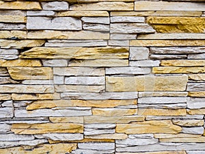 Part of stone masonry with rectangular stones, rough old wall background