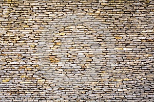 Part of a stone wall, for background or texture .