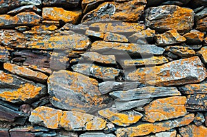 Part of stone wall at Gergeti trinity church or Tsminda Sameba, Georgia.