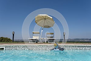 Part of swimming pool with blue water in italy