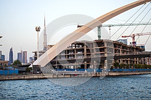 Part of `Tolerance bridge` structure in Dubai. `Dubai water canal`, UAE. Tallest building in the world `Burj Khalifa` can also be