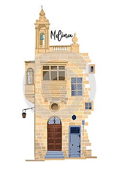 Part of traditional maltese house in Mdina made of sandy stone bricks with various doors, windows and balconies