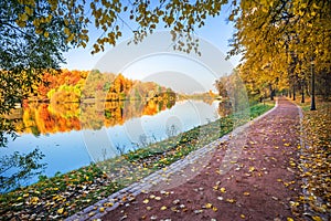 Part of Tsaritsyno park in Moscow with colorful autumn trees with mirror reflection