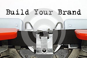 Part of typing machine with typed Build Your Brand words