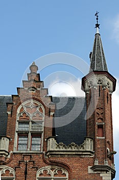 The architectural medieval style of the buildings in Bruges.