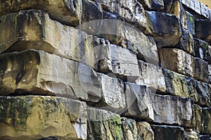 Part of a wall made of large stone blocks