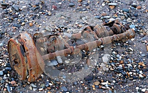 Part of wartime engine on beach in east Yorkshire, UK.