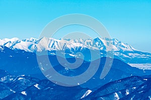 Part of Western Tatras and High Tatras mountains from Velka luka hill in winter Mala Fatra mountains in Slovakia