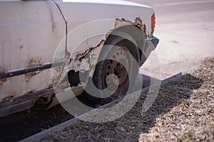 Part of a white old rusty machine
