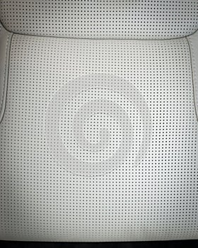 Part of white perforated leather