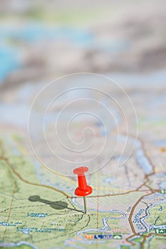 Part of the world topo map as ultimate item for successful travel and red push pin as location marker, abstract, background, paste