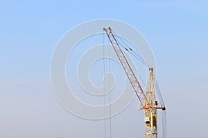 Part of yellow stationary hoist on construction site