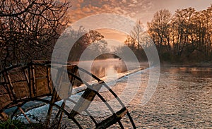 Partage des Eaux ,translation the parting of the water , L isle sur la sorgue , Vaucluse , France . at dawn with mist rising from