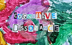 Partial blurred cut out colored letters from magazines and compilation of cognitive dissonance