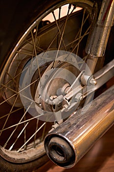 Partial close-up of the engine of an old motorcycle