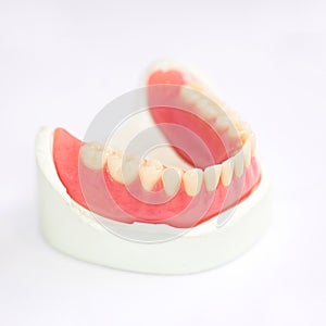 Partial denture production on white background